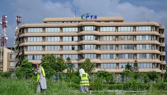 People work near the Pakistan Telecommunication Authority (PTA) headquarters building in Islamabad on August 16, 2024. — AFP