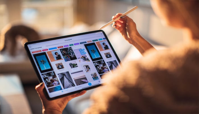 An undated image showing a girl using iPad. — Pexels
