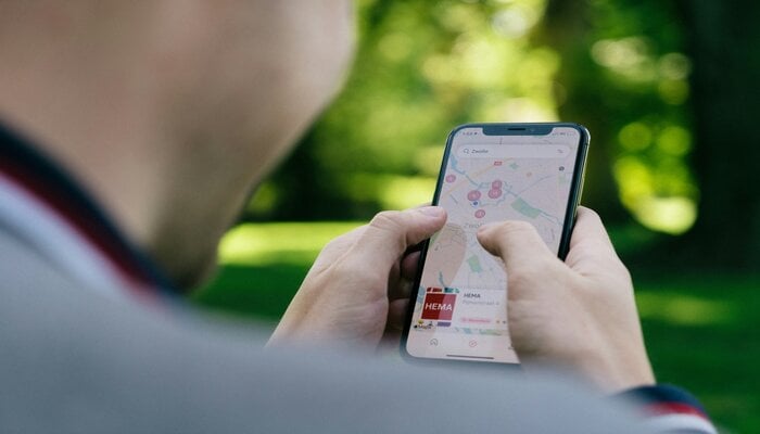 An undated image of a person using Apple Maps. — Unsplash