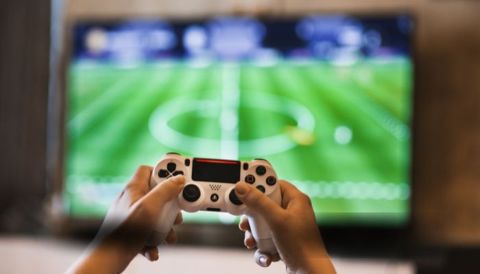 An undated image of a person playing games. — Canva
