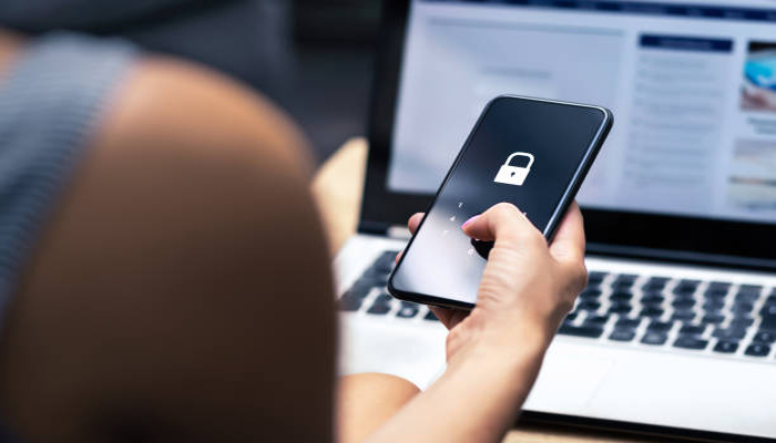 An undated image showing a person accessing private space app on a smartphone. — iStock