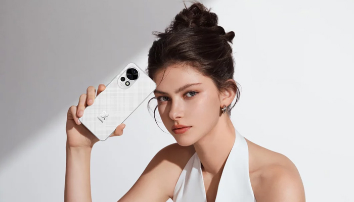An undated image showing a girl holding Huawei Nova 13. — Huawei