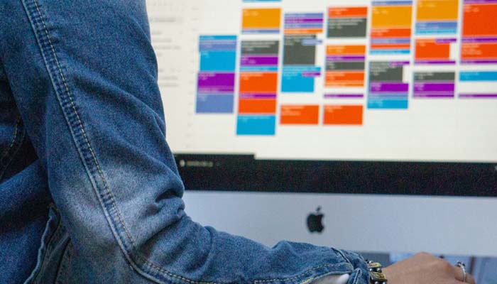 An undated image of a person using Google Calendar. — Unsplash