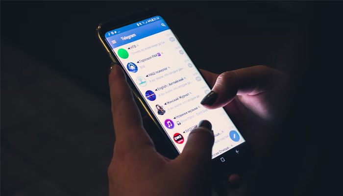 An undated image of a woman using an Android phone. — Unsplash
