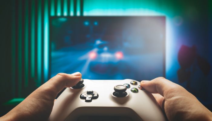 An undated image of a person using a gaming console. — Canva