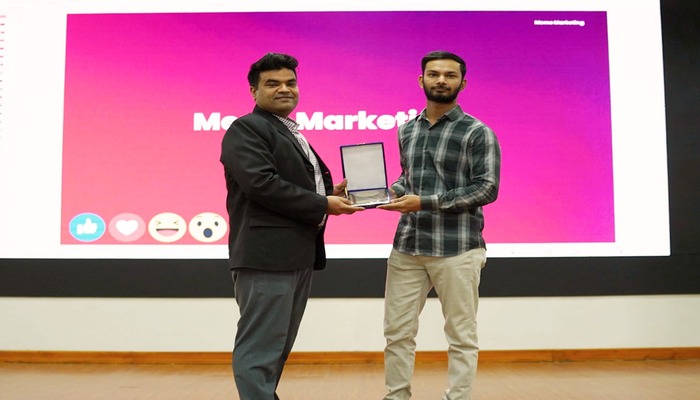 An undated image of Arham Imtiaz receiving an award on meme marketing at an event. — LinkedIn/arhamimtiaz97