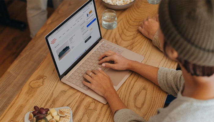 An undated image of a person using Microsoft Window on a laptop. — Unsplash