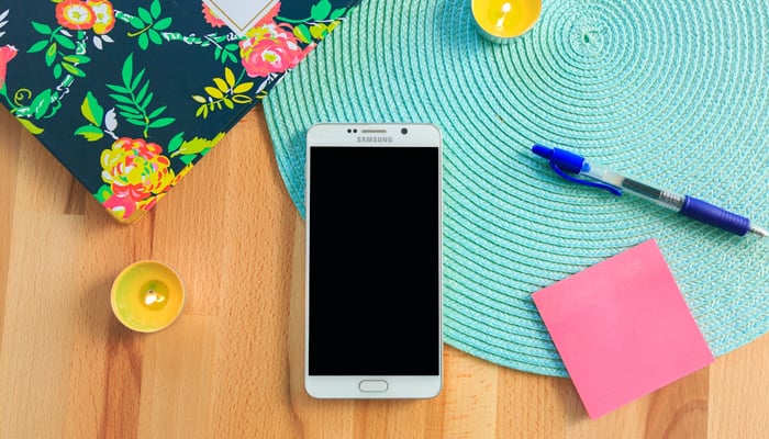 An undated image of Samsung smartphone on a desk. — Unsplash
