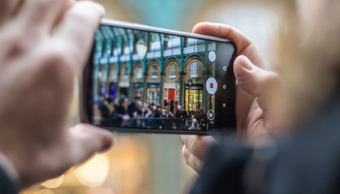 An undated image of a person taking a picture from android smartphone. — Unsplash
