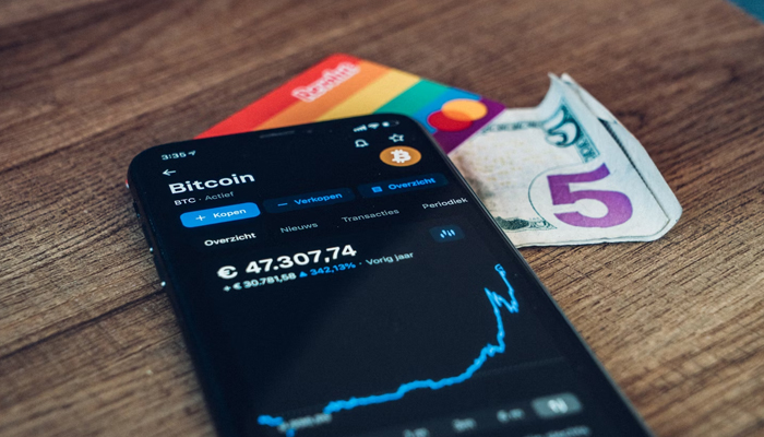 An undated image of bitcoin stocks rising in a smartphone. — Unsplash