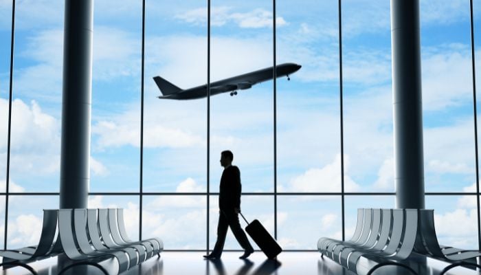 An undated image of a person at the airport. — Canva