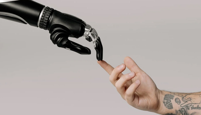 An representational undated image of connection between AI and human. — Pexels