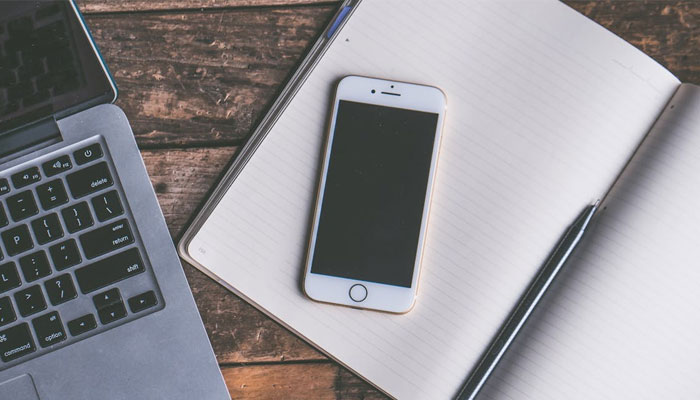 An undated image of an iPhone placed on table. — Pexels