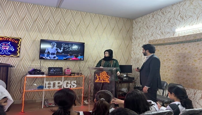 A still image of Miss Anny and Hassan Khan interacting with Happy Palace Isphani Campus students on November 26, 2024. — Photo by author