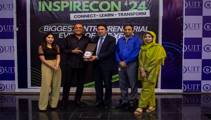 A still image showing Coffee Wagera CEO Mush Panjwani receiving appreciation shield from Usman Institute of Technology University Vice Chancellor Vali Uddin on November 26, 2024 at InspireCon 24 event. — Photo by author