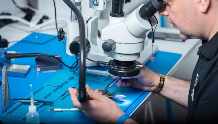 An undated image of a person making a semiconductor chip. — Pexels
