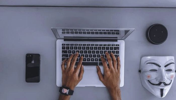 An undated image of a scammer using a laptop. — Pexels/ Canva