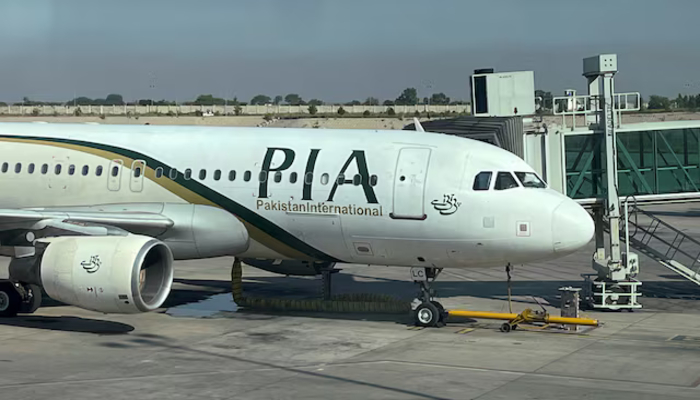 View of a PIA passenger plane, taken through a glass panel, at Islamabad International Airport, Pakistan October 3, 2023. — Reuters