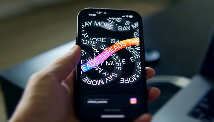 An undated image of Threads app displayed on a phone. — Unsplash