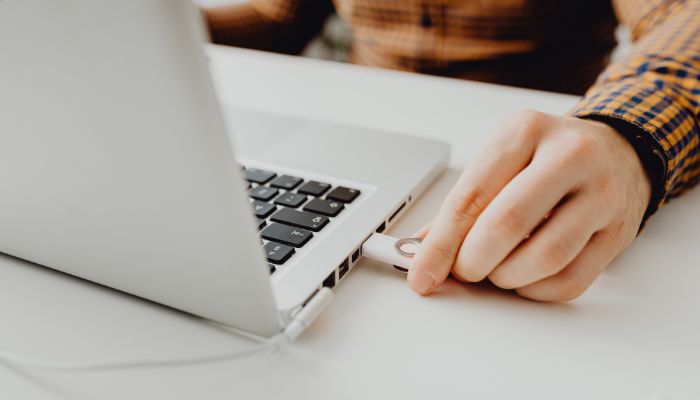 An undated imag of a person using laptop. — Canva