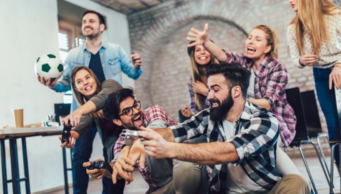 An undated image of people playing games. — Canva
