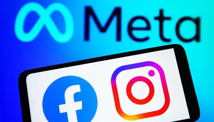 A undated image showing Facebook, Instagram logo on a smartphone, along with Meta logo in background. — Getty Images