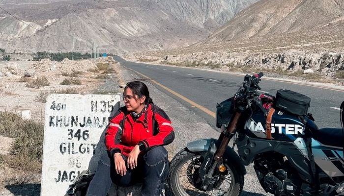 An undated image of Zenith Irfan sitting by the roadside. — Zenith Irfan/Canva