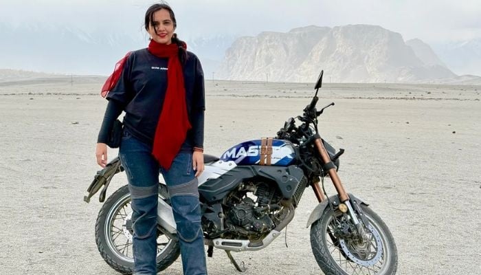 An undated image of Zenith Irfan standing in front of her bike. — Zenith Irfan/Reddit