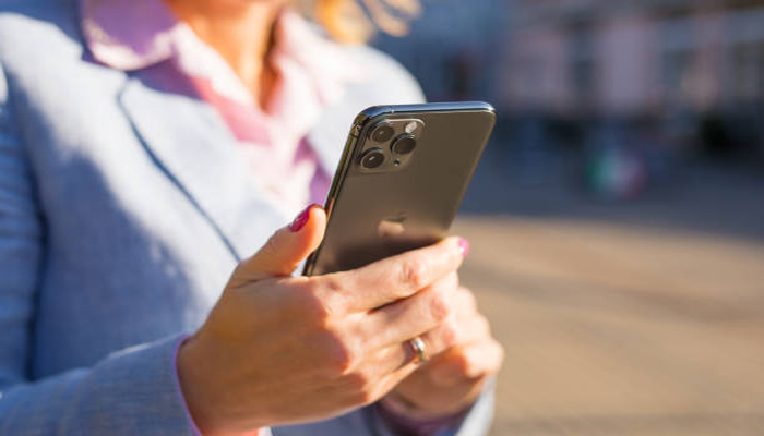An undated image of a person using iPhone. — iStock