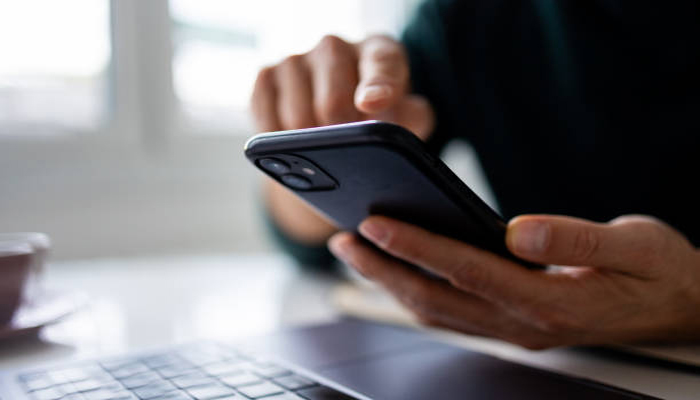 An undated image of a person using iPhone. — iStock