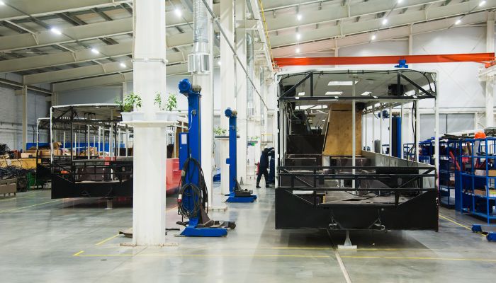 An undated image of a bus manufacturing plant. — Canva