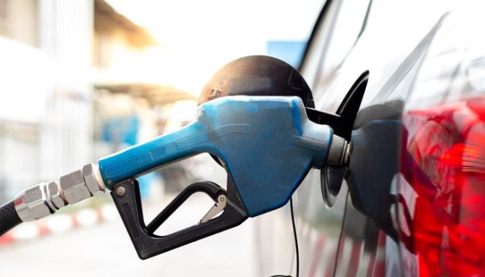 An undated image of a car at a petrol pump. — Canva