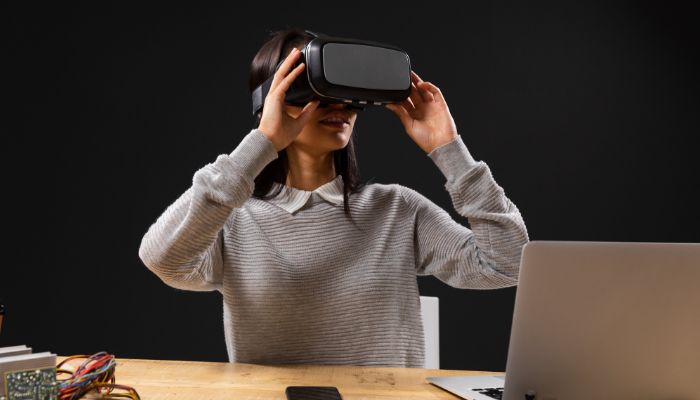 An undated image of a girl wearing a virtual reality headset. — Canva