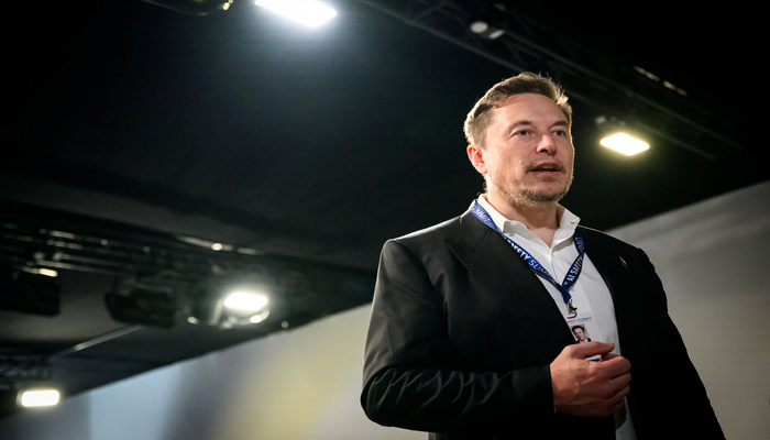 Elon Musk speaks with members of the media during the AI Safety Summit at Bletchley Park in Bletchley, Britain on November 1, 2023. — Reuters