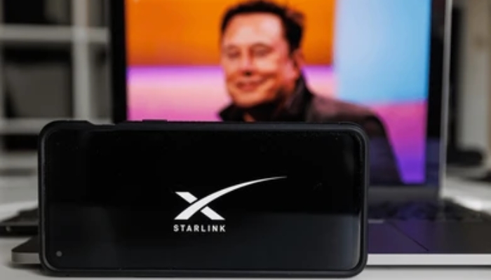 An undated image of Starlink logo with Elon Musks picture in the background. — Shutterstock