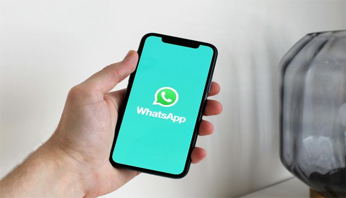 An undated image of WhatsApp logo displayed on a smartphone. — Pexels