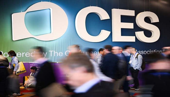 The CES logo is displayed as attendees enter an exhibit hall during the Consumer Electronics Show (CES) in Las Vegas, Nevada, on January 7, 2025. — AFP