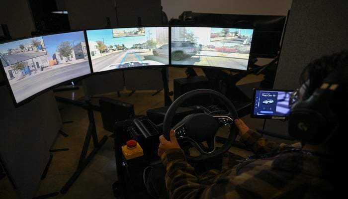 A remote driver steers a Kia electric vehicle from Vay during a live demonstration of remote driving on city streets, seen from the company´s control center prior to the Consumer Electronics Show (CES) in Las Vegas, Nevada, on January 6, 2025. — AFP