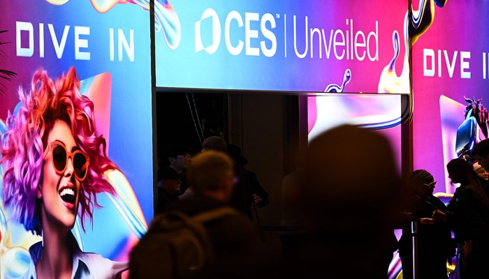 The CES logo is displayed as attendees enter CES Unveiled ahead of the Consumer Electronics Show (CES) in Las Vegas, Nevada on January 5, 2025. — AFP