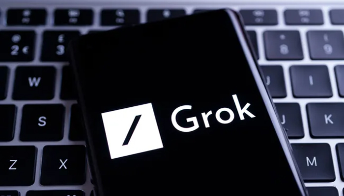 An undated image of Grok app logo displayed on a smartphone. — ShutterStock