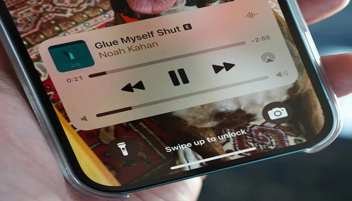 An undated of volume slider on iPhone Lock Screen. — Shutterstock