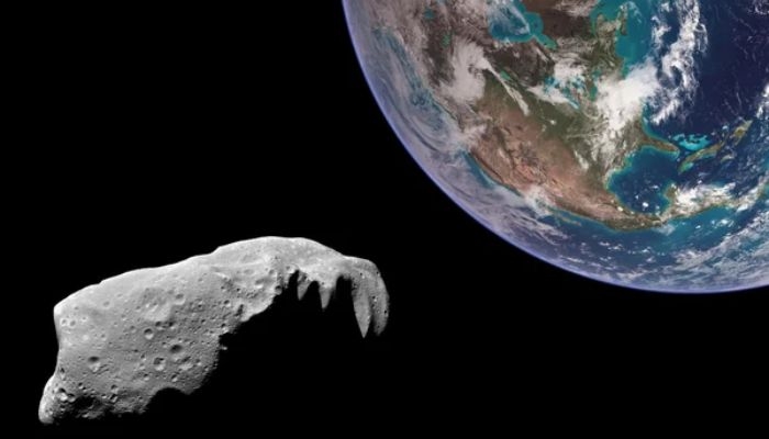 An undated image of an asteroid passing through the Earth. — Depositphotos