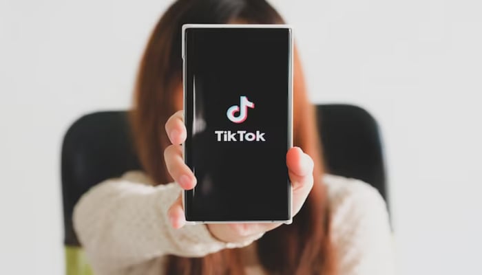 An undated image of TikTok logo on a mobile screen. — Freepik