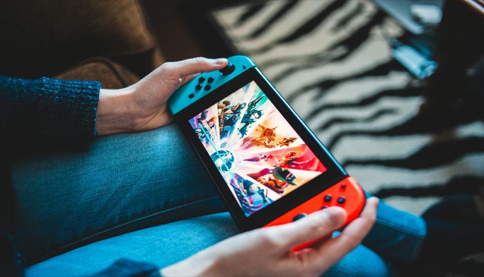 An undated image of person playing game on Nintendo Switch. — Unsplash