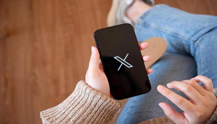 An undated image of X (formerly Twitter) app logo showed on smartphone. — Vecteezy