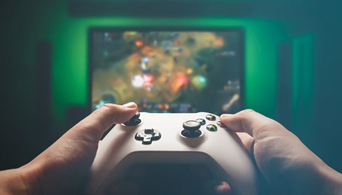An undated image of a person playing video game. — Canva