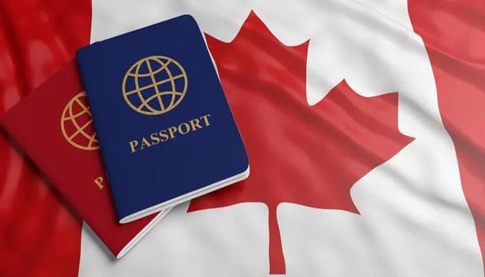 An undated image of Canada flag with passport. — Getty Images