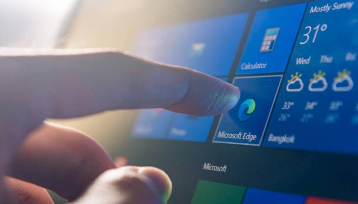 An undated image of person clicking Microsoft Edge. — iStock
