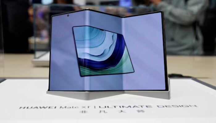 Huaweis new tri-foldable smartphone Mate XT is seen displayed in a glass case at a Huawei flagship store in Beijing, China September 10, 2024. — Reuters
