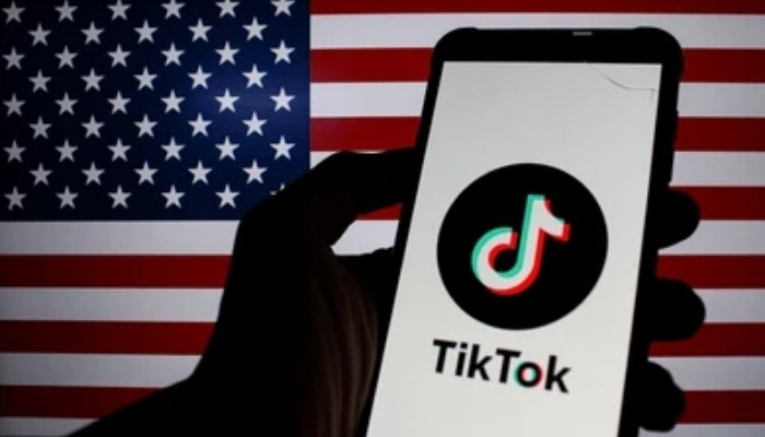 An undated image of the Tiktok apps logo with the United States flag on the background. — Shutterstock